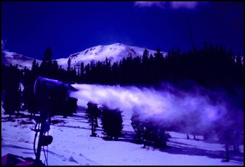 A snowmaking gun blasts away.